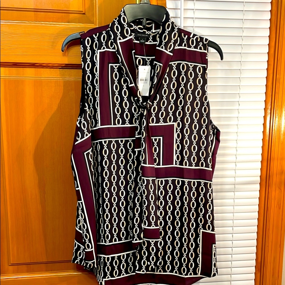 Never worn Ann Taylor sleeveless blouse.